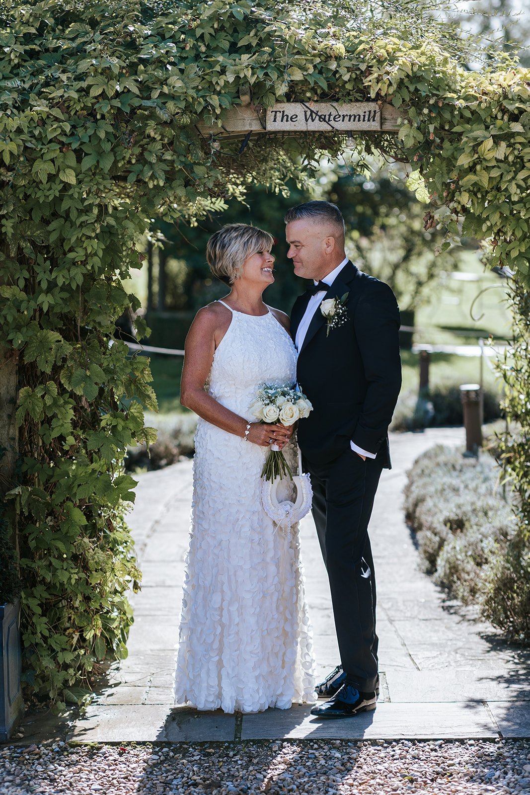 Bride and Groom under archway